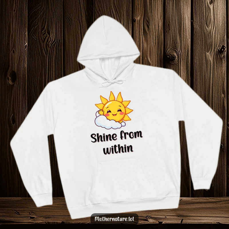 Funny smiling sun character waving enthusiastically from behind a giggling cloud, featured on a warm and soft hoodie.
