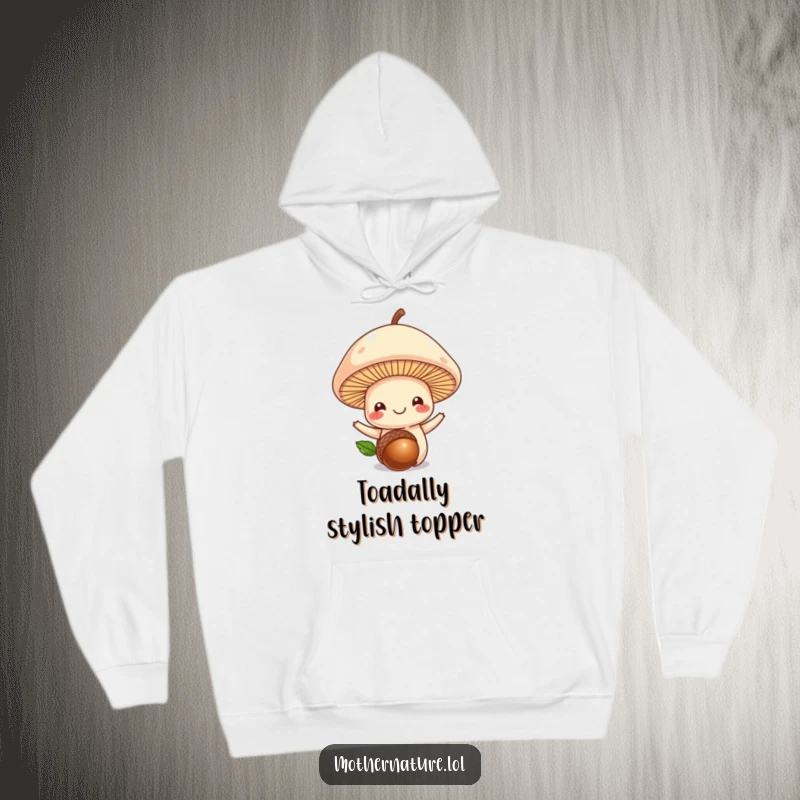 Funny mushroom hoodie, smiling mushroom balancing an acorn on its head, cozy and whimsical apparel, delightful nature gift.