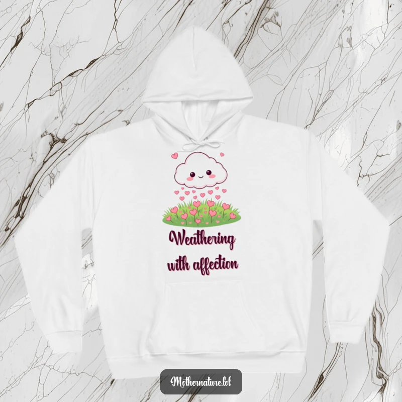 Funny hoodie featuring a cloud character playfully raining small hearts onto a meadow, perfect for cozy days.