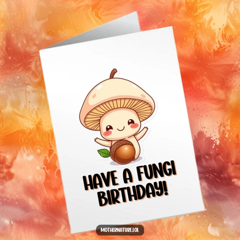 Funny Free Printable Birthday Card: A smiling mushroom balances an acorn, a cute and funny downloadable gift for nature lovers.